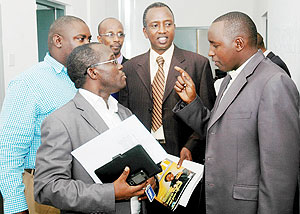 Media representatives with the Director General in the Ministry of Information Ignatius Kabagambe (C) after Thursdayu2019s Meeting. (Photo J Mbanda)
