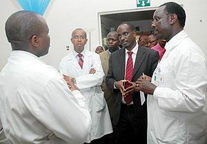 Health Minister Richard Sezibera with Kigali central Hospital Director Theobald Hategekimana and other staff during the Ministeru2019s tour of the Hospital Yesterday. (Photo J Mbanda)