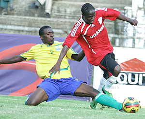 Rwandau2019s Uwirimana Amaan tackles Ugandau2019s Stephen Bengo in the final game of the 2009 Cecafa Senior Challenge Cup in Nairobi last weekend.