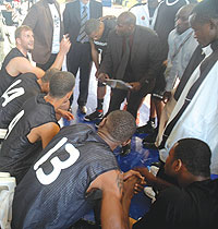 APR coach Cliff Owuor and his players plotting how to overcome Primeiro yesterday. The latter won 98-84 to reach the fina. (Photo/ J. Mbanda)