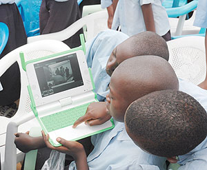 Kagugu Primary School boys use wireless Internet off their laptops. (File Photo)