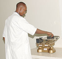 An RBS employee displays some of the modern weighing scales. The Standards bureau has embarked on a campaign of confiscating sub-standard scales