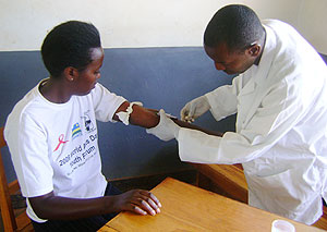 Mukanyarwaya Marie Chantal, leads other 400 students to test for HIV. 