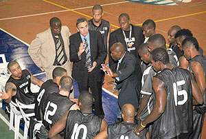 APRu2019s coach Cliff Owour (C) giving his players instructions during the just concluded Fiba Africa Club Championship where the Rwandan champions finished third.