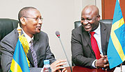 Finance Minister John Rwangombwa chats with the SIDA Country Director Richard Bomboma shortly before signing. (Photo J Mbanda)