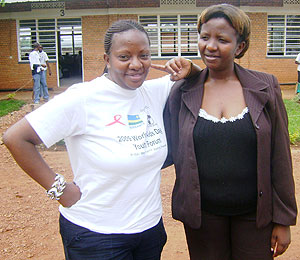 Claire Gasamagera Tuyishime(L. in T-shirt) advocates for children born with HIV.