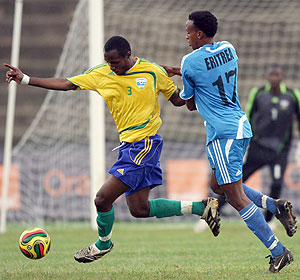Kalisa Mao (left) battles against Isaias Andeberhian of Eritrea during the 2009 Cecafa Senior Challenge Cup in Nairobi. But the APR defender has been left out of the new squad due to a broken arm.