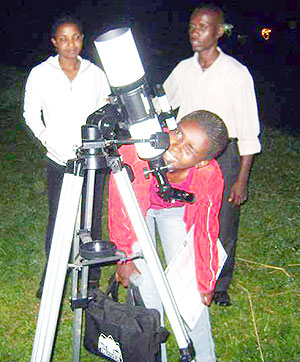 KIE students during a night sky observation using a telescope.