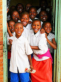 Enchanted boys and girls at Kimisagara youth centre.