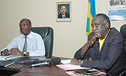 Ombudsman Tito Rutaremara(R) making the announcement to the media recently as the Minister of Labour and Public Service, Anastase Murekezi looks on (File photo)