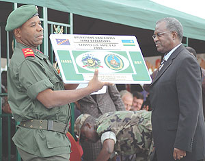 DR Congo Gen.Didier Etumba presents Umoja wetu Logo to Rwandau2019s Defence Minister Marcel Gatsinzi at the end of the operation early last year.
