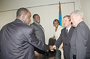 French foreign Minister Bernard Kouchner (2nd right) greets Hon.Gideon Kayinamura at Parliament. (Photo/ J. Mbanda)
