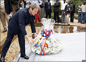 French Foreign Minister Bernard Kouchner laying a wreath on a grave in at the Gisozi Memorial. Rwandan-French relations have improve drastically