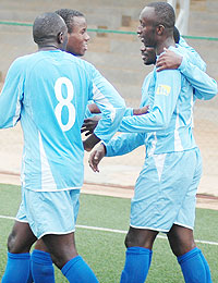 Rayonu2019s Yusuf Ndayishimiye is mobbed by teammates after scoring against Atraco this season.  The Blues will close in on APR and Atraco if they beat Kiyovu on Sunday. (File Photo)