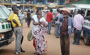 THE OTHER ONE: A taxi conductor shows a potential commuter his taxi. He will now be required to wear a grey uniform