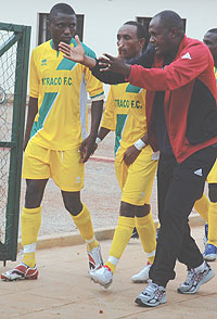 Atracou2019s Emmanuel Ruremesha gives a few tips to his players shortly before the Rayon Sport game. Atraco lost the encounter 3-0 before bouncing back to win last Sundayu2019s tie. (File Photo)