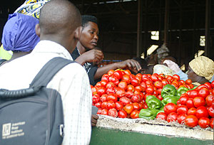 Traders selling tomatoes in Kimironko market.