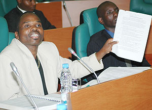 Party head Bernard Ntaganda flashes a document before Senate yesterday. (Photo/ J Mbanda)
