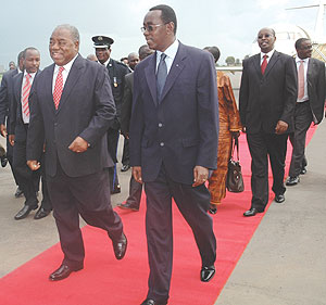 Zambian President Rupia Banda (L) with Prime Minister Bernard Makuza at Kigali International Airport yesterday.  The Zambian President is here for a two day visit. (Photo/ J. Mbanda)