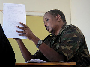 Lt. Col. Paul Semana explaining to the military tribunal yesterday the technicalities of the topography in the construction of Gashora Dyke. (Photo/ E. Mutara)