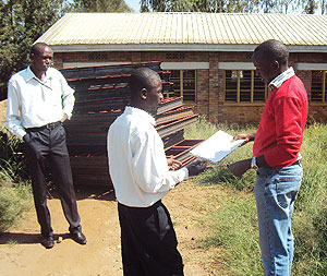ADRA-RIREPu2019s  assistant administrator, Aman Ngamije handing over the assorted  donation to Rukomo sector executive secretary, Emmanuel Hakuzweyezu. 