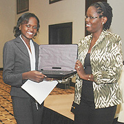 The New Timesu2019 Irene V. Nambi receiving her award from Denise Mupfasoni of Access Project yesterday (Photo/ F. Goodman)
