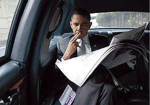 The president scans the headlines on his way back to the White House.