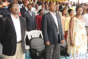 Local Government Minister James Musoni (Middle) leads KCC Local Leaders through the National Anthem shortly before the meeting started. Right is City Mayor Aisa Kirabo Kacyira. (Photo/F.Goodman)