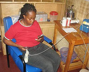 Mother pumping breast milk at the breastfeeding corner at KHI   
