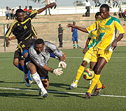 Atracou2019s Ismail Habumugisha is foiled by El- Amal keeper during Sundayu2019s clash at Nyamirambo stadium. Atraco won 2-0 but  El- Amal  coach is confident his team can still progress. (Photo J.Mbanda).