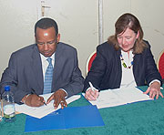 WFP Country Director Abdoulaye Baldu00e9 and Plan International's Rosemary Mc Carney during the signing yesterday (Photo F Goodman).