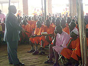 Aime Bosenibamwe discussing with inmates in Ruhengeri prison. (Photo / B. Mukombozi)