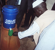 A demonstration of how Silver Ceramics Water Filtration works during its launch yesterday. (Photo/ I. Mugisha)