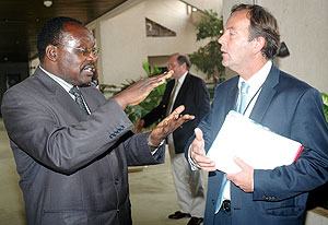 BNR Governor Francois Kanimba (L)  and Banque Populaire Managing Director Ben Kalman. (Photo J Mbanda)
