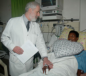 Dr.Harold Goldberg talks to a Heart patient at King Fisal Hospital On Wednesday (Photo J Mbanda)