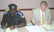 Commissioner General of Police Emmanuel Gasana and Canadau2019s Richard Le Bars signing the MoU yesterday. (Photo/ F. Goodman)