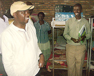 JMV Makombe(L) and headmaster  Stephen Rwamurangwa (R) inpecting the girlsu2019 dormitory at the school. (Photo / S. Rwembeho)