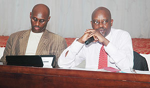 RRAu2019s Nkusi Mukubu and Ben Kagarama explain tax issues to the large taxpayers. Photo F. Goodman)