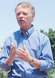USAID Mission director, Dennis Weller addressing Busoro sector residents in Nyanza district. (Courtesy photo)