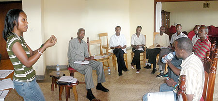 Munganyinka addresses University youth while Mr. Calixtte Kayisire of MINEDUC looks on. This was during a NAR Youth Discussion Forum on Education in Rwanda. (Photo by G. Anyango)