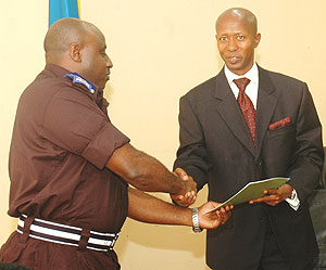 Minister Musa Fazil Harelimana and the Commissioner General of Police, Emmanuel Gasana after the signing yesterday. (Photo/ F.Goodman)
