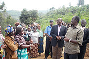 Residents of Nyundo village in Rugendabari sector, Muhanga district, talking to Premier Bernard Makuza. (Photo: D. Sabiiti)