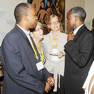 Education Minister Charles Murigande (R) talks to participants at the conference on Teachers Development and Management yesterday. (Photo J. Mbanda)