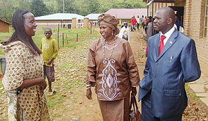 MP Samuel Musabyimana (right) having a light moment with local leaders shortly before the ceremony on Monday. (Photo: S. Nkurunziza)