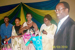 Governor Fidu00e8le Ndayisaba presents awards to outstanding women in development. (Photo: D. Sabiiti)