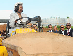 Commerce and Industry Minister Monique Nsanzabaganwa drives a tractor at the groundbreaking ceremony for Bakhresa Milling Project at the Industrial park yesterday. (Photo J Mbanda)