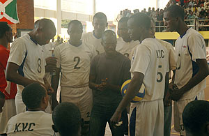 KVC players take tips from their coach Nsengiyumva during last yearu2019s Coupe du Rwanda competition. The team were losing finalists over the weekend. (File Photo)