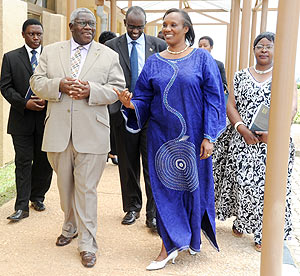CPA Secretary General Dr.William Shija (L)  sharing a light moment with Speaker Rose Mukantabana at the Parliamentary buildings on Thursday. (Photo J Mbanda)