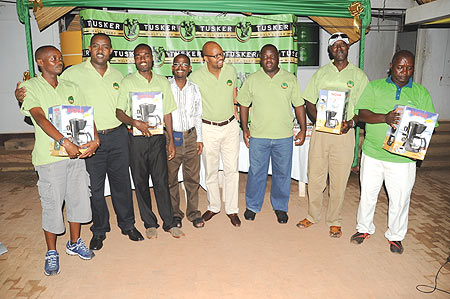 Winners: F. Rubangura, J. Semwaga, E. Sengamungu and S. Katwiremu pose with their prizes with Tusker and Kigali golf Union officials yesterday at Kigali Golf Club. (Photo/J. Mbanda)