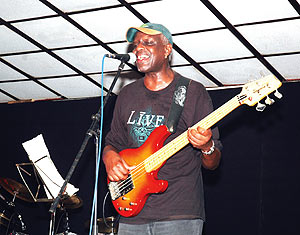 Rwandau2019s jazz singer Mutsar playing his guitar.